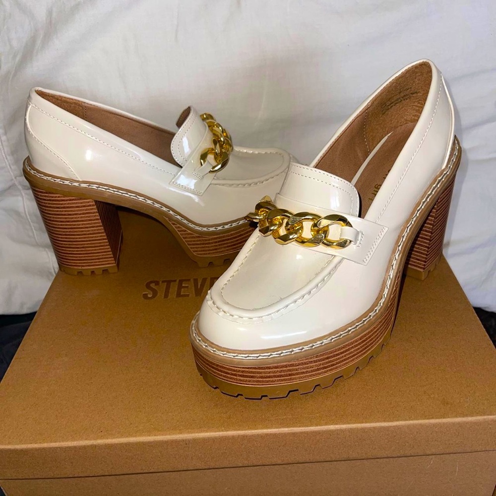 These are Steve Madden loafers in white, cream and tan colour